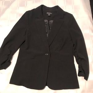 Black blazer with 3/4 sleeves.